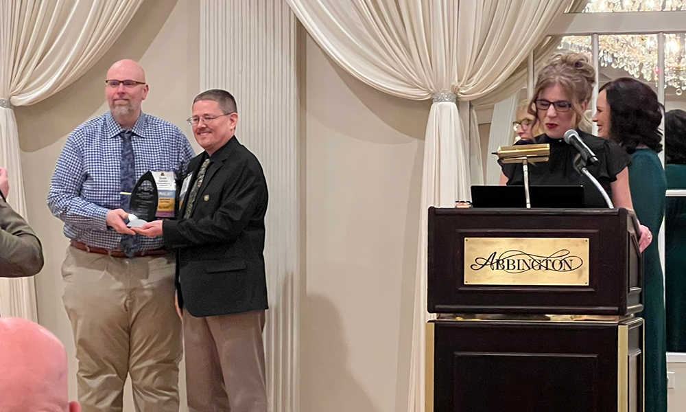 Social Responsibility Award being accepted by Scott and Tim